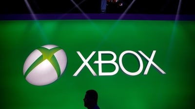 FILE - A man walks past the Xbox logo at the Microsoft booth during the E3 game show in Los Angeles, Tuesday, June 11, 2013. (AP Photo/Jae C. Hong, File) (AP Photo/Jae C. Hong)