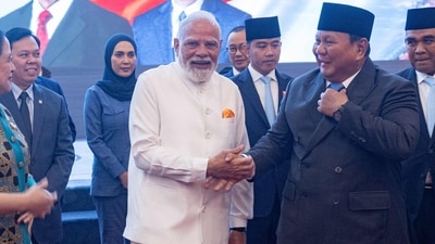 India's Prime Minister Narendra Modi (C) shakes hands with Indonesia's President Prabowo Subianto during his visit at the parliament building in Jakarta on July 7, 2026. (AFP)