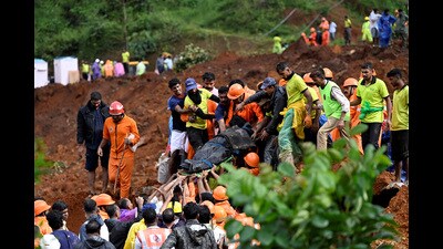 Rescue personnel carry a victim’s body at the site of the mudslide in Wayanad on Tuesday. (REUTERS) Rescue personnel carry a victim’s body at the site of the mudslide in Wayanad on Tuesday. (REUTERS)