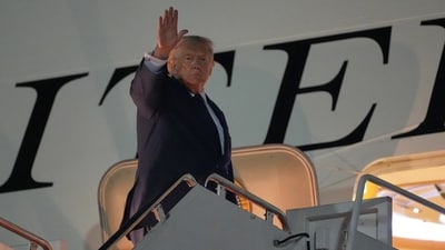 US President Donald Trump ahead of his departure for the NATO summit in Ankara. (AP Photo/Alex Brandon) US President Donald Trump ahead of his departure for the NATO summit in Ankara. (AP Photo/Alex Brandon)