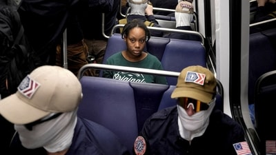 FILE PHOTO: A commuter sits as members of the group Patriot Front ride the metro on the 250th anniversary of U.S. independence on the Fourth of July in Washington, D.C., U.S., July 4, 2026. REUTERS/Cheney Orr/File Photo (REUTERS)