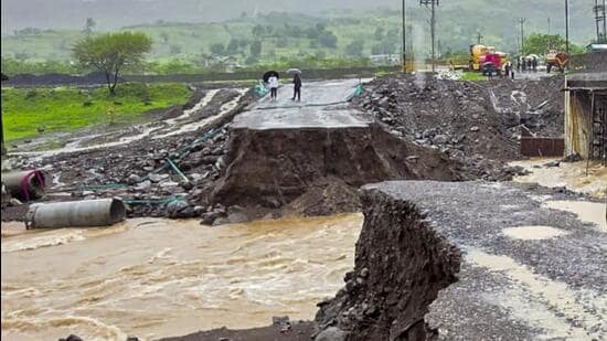 A view of the temporary bridge connecting Pahine and Bhilmal villages in Trimbakeshwar tehsil that was washed away following heavy rainfall, in Nashik district, Tuesday. Heavy rains lashed parts of Nashik on Tuesday, but no cloudburst was reported anywhere around the district. (PTI)