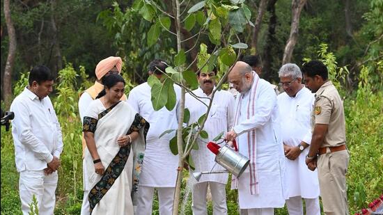 Amit Shah along with other ministers during the plantation drive at Nanaksar Ridge on Tuesday. (Arvind Yadav/HT Photo)