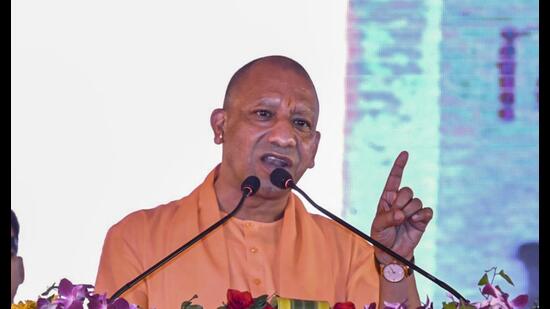 Chief minister Yogi Adityanath speaks during foundation stone laying ceremony of various development projects, in Pratapgarh district on Tuesday. (PTI)