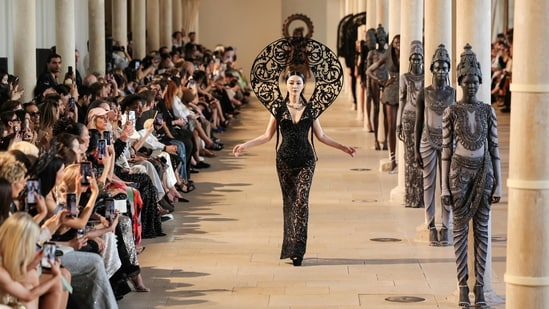 Chinese actress Fan Bingbing dazzled in a black bodycon gown with intricate detailing and a dramatic sculptural headpiece.(AFP)