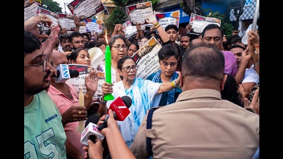 Former West Bengal chief minister and TMC supremo Mamata Banerjee with supporters stages a candle march to protest the alleged rape and murder of an 11-year-old girl at Baruipur, in Kolkata. (@AITCofficial)