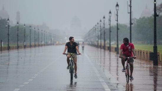 Gram it: After recording the hottest July day in two years on Monday, Delhi witnessed pleasant rains on Tuesday. Enjoying the weather to its fullest were some residents who took to cycling amid rainfall at Kartavya Path. Those of you planning to step out today can expect cloudy sky and light rain, as per India Met Department (IMD). (Photo: Salman Ali/PTI)