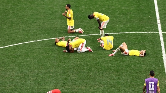 Colombia players looked dejected after losing the penalty shootout, as Colombia were eliminated from the World Cup.(REUTERS)