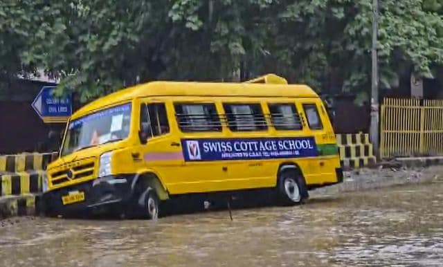 A school bus skid and went off road near Civil Lines on Tuesday. (PTI) A school bus skid and went off road near Civil Lines on Tuesday. (PTI)