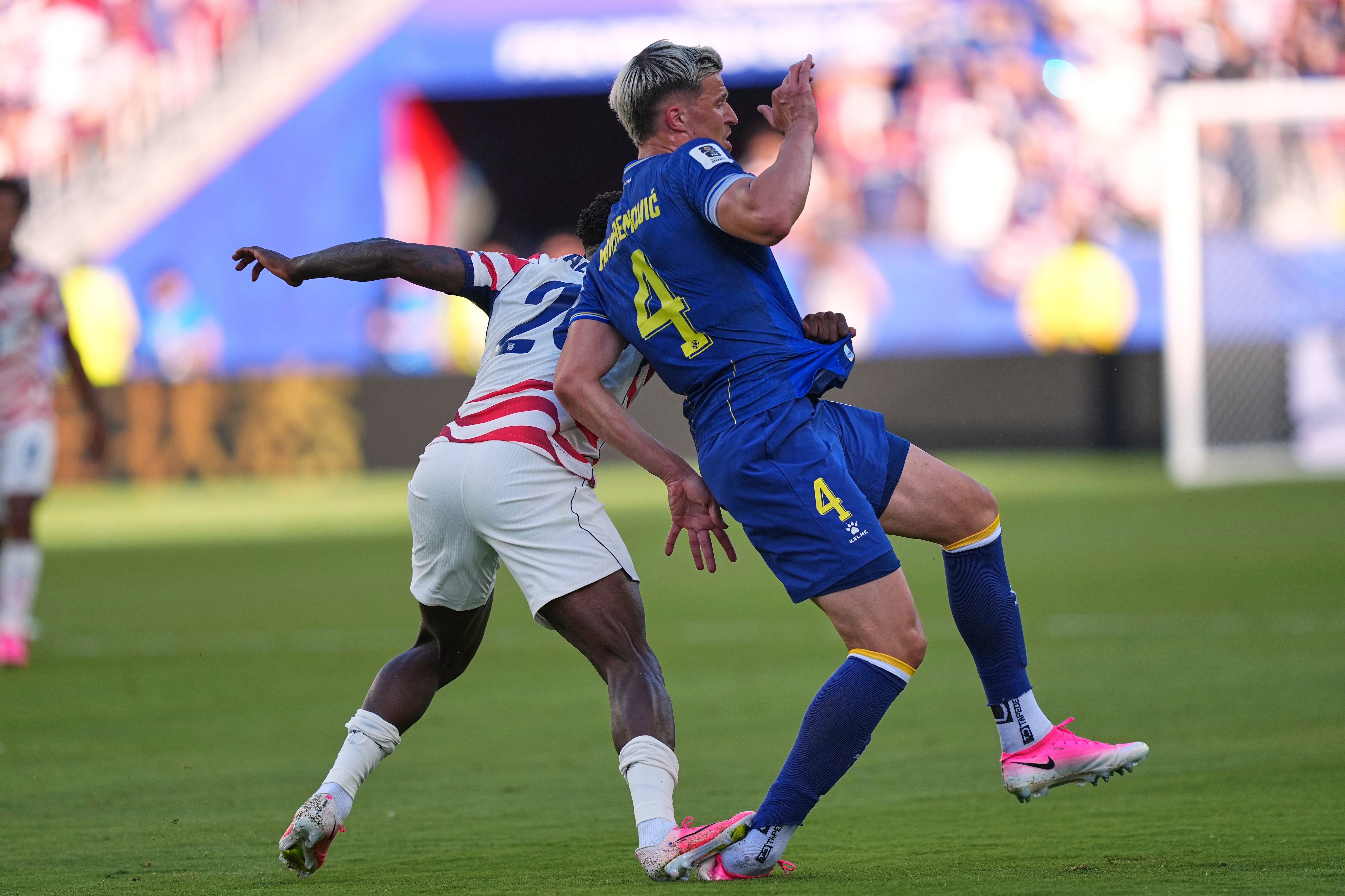 United States' Folarin Balogun (20) puts his foot down on Bosnia's Tarik Muharemovic (4) for which he received a red card during the World Cup round of 32 football match between the United States and Bosnia. (AP) United States' Folarin Balogun (20) puts his foot down on Bosnia's Tarik Muharemovic (4) for which he received a red card during the World Cup round of 32 football match between the United States and Bosnia. (AP)
