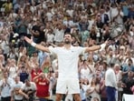 Novak Djokovic of Serbia celebrates winning against Felix Auger-Aliassime of Canada in their quarter-final men's singles match at the Wimbledon