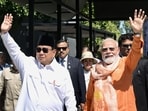 Prime Minister Narendra Modi, right, and Indonesian President Prabowo Subianto wave during their visit to Prambanan Temple, in Yogyakarta, Indonesia, Wednesday, July 8, 2026. 