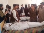 Relatives gather around the body of a slain policeman at a hospital in Ziarat, in Balochistan province on July 7, 2026. 