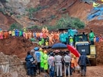 A bus stuck in debris after a landslide at Kalladi, near Meppadi tunnel project in Wayanad, Kerala.