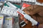 A medicine distributor displays Mounjaro (tirzepatide) self-injecting GLP-1 prefilled pens at his office in Thane on March 20, 2026. (AFP FILE)