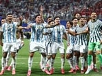 Argentina players celebrate after the match as Argentina qualify for the quarter finals of the World Cup