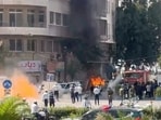 Emergency personnel work as smoke and fire rise at the site where explosive devices blew up near a hotel where French President Emmanuel Macron was meant to be staying, in Damascus, Syria, in this screengrab obtained from a video, July 7, 2026. (REUTERS)