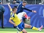 Sweden's Gustaf Lagerbielke (L) and France's Adrien Rabiot in action during their FIFA World Cup match. (AFP)