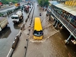 Vehicles wade through a waterlogged stretch amid heavy rain on the NH-48 service road near Narsinghpur village in Gurugram.