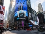 A display in Times Square shows Eric Trump speaking about a partnership between World Liberty Financial and Alt5 Sigma in 2025.
