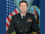 The US Navy has identified Cmdr Gabriel Edwards as the missing sailor after an Arabian Sea helicopter emergency.