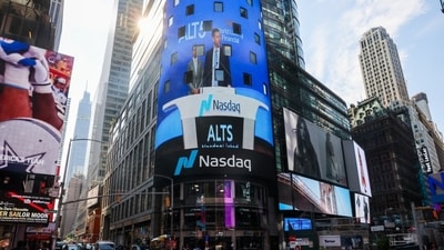 A display in Times Square shows Eric Trump speaking about a partnership between World Liberty Financial and Alt5 Sigma in 2025.
