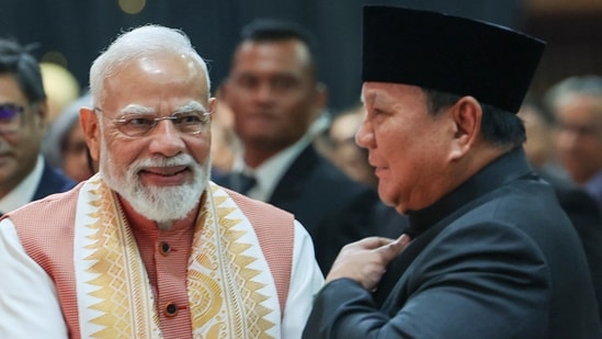 Prime Minister Narendra Modi shakes hands with Indonesian President Prabowo Subianto during an Indian community event, in Jakarta on Tuesday. (DPR PMO )