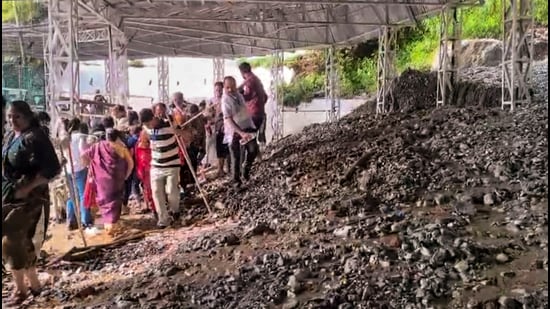 Debris scattered across the Vaishno Devi Yatra route after a heavy rainfall caused a minor landslide near Himkoti on Wednesday. (PTI)