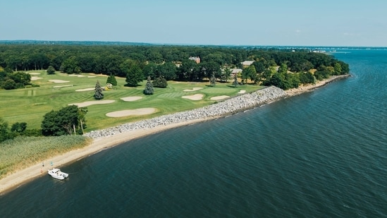 The club says the wall is needed to keep its signature hole from slipping into the sea.
