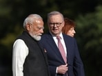 Australia's Prime Minister Anthony Albanese talks with Indian Prime Minister Narendra Modi.