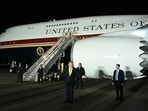 US President Donald Trump gestures in front of Air Force One after disembarking from the older VC-25A Air Force One at Royal Air Force (RAF) Mildenhall in Mildenhall, eastern England.