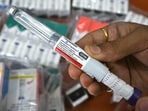 A distributor displays Mounjaro (tirzepatide) self-injecting GLP-1 prefilled pens at his office in Thane, Mumbai.  