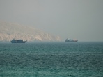 Vessels at the Strait of Hormuz, as seen from Musandam, Oman, July 9, 2026. 