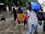 Mumbai, India - June 09, 2021: People wade through a waterlogged road at King's Circle, in Mumbai, India, on Wednesday, June 09, 2021. (Photo by Satish Bate/Hindustan Times) (Satish Bate/HT PHOTO)
