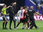 A member of Egypt's coaching staff is shown a red card by referee Francois Letexier