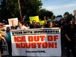 People march through the streets during a vigil for Lorenzo Salgado Araujo, a Mexican national fatally shot by a federal immigration agent a day prior, Wednesday, July 8, 2026, in Houston. (AP Photo/Mark Felix)(AP Photo/Mark Felix)
