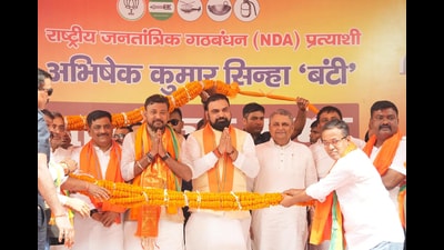 Bihar chief minister Samrat Choudhary with BJP candidate of Bankipur assembly constituency Abhishek Sinha Bunty, Deputy CM Vijay Choudhary and NDA leaders being garlanded during nomination meeting in Patna. (Santosh Kumar/ HT)