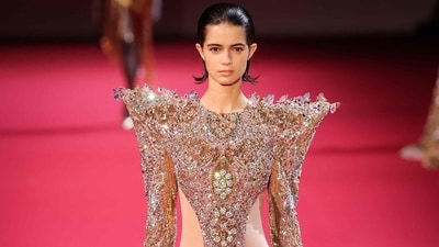 A model presents a creation by Manish Malhotra for the Women's Haute Couture Fall/Winter 2026-2027 collection. (AFP) A model presents a creation by Manish Malhotra for the Women's Haute Couture Fall/Winter 2026-2027 collection. (AFP)