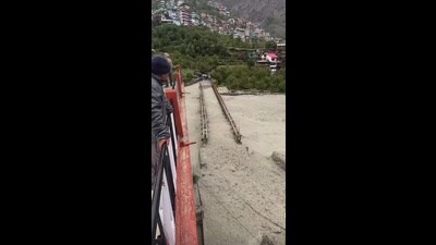 The submerged bridge in Kinnaur on Thursday. (HT Photo) The submerged bridge in Kinnaur on Thursday. (HT Photo)