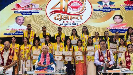 Governor Anandiben Patel and others pose for a group photograph with graduates during the 41st Convocation Ceremony at Chhatrapati Shahu Ji Maharaj University, in Kanpur on Thursday. (ANI)