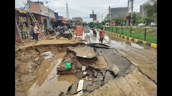 The road, opposite Ullahwas village, has also developed a sinkhole measuring around 10 feet by 15 feet, rendering the entire stretch unusable until repairs are carried out. (Parveen Kumar/HT)