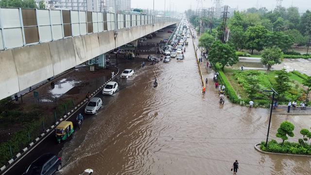 Waterlogged stretch of Sohna Road slowed traffic on Wednesday. (ANI Video Grab)