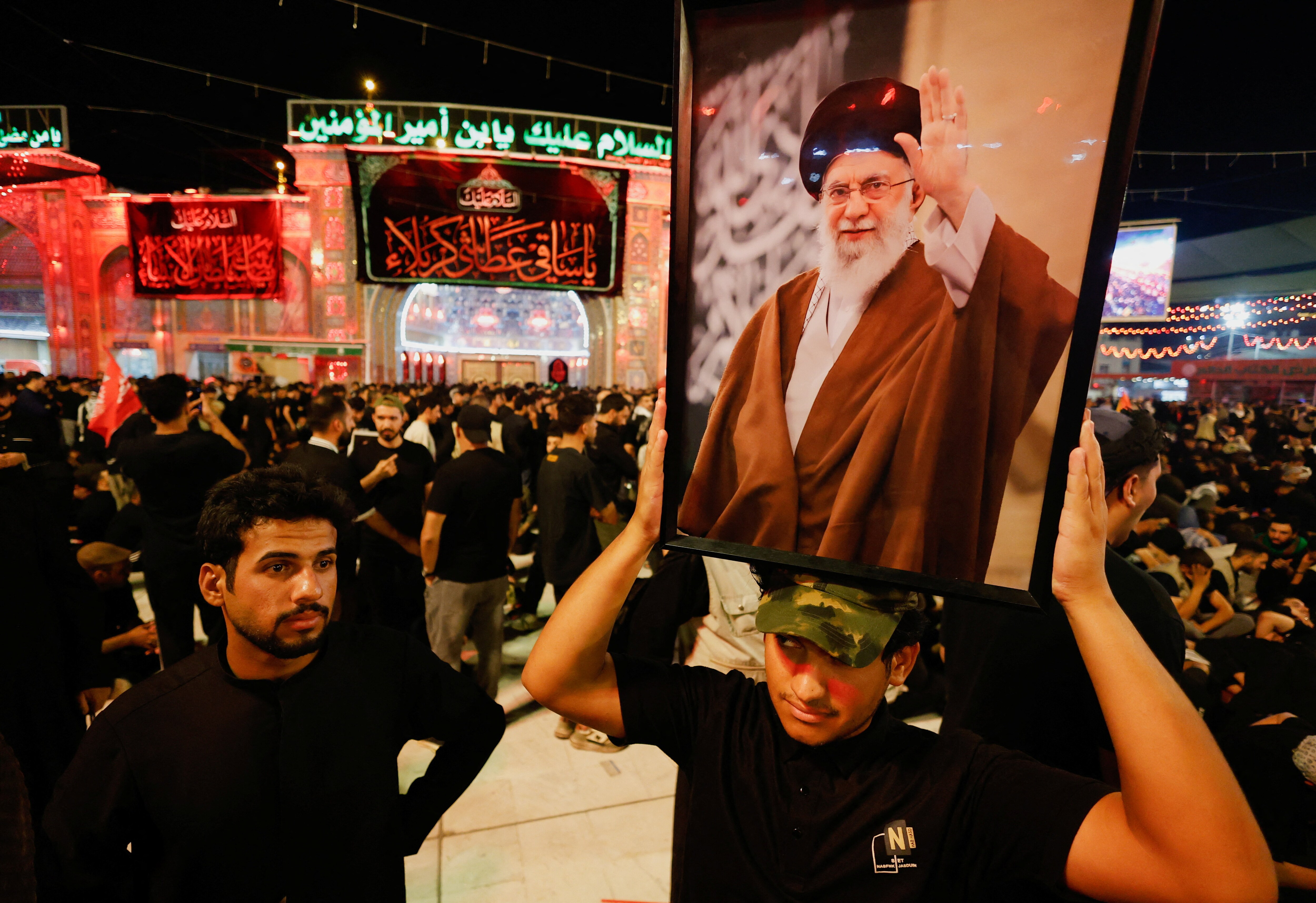 A man holds a portrait of Iran's late Supreme Leader Ayatollah Ali Khamenei, who was killed on February 28 in Israeli and U.S. airstrikes, as people gather for a funeral procession, in Karbala, Iraq, July 9, 2026. REUTERS/Khalid Al-Mousily (REUTERS)