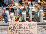 HOUSTON, TEXAS - JULY 09: Flowers and candles are situated at a makeshift memorial site where Mexican immigrant Lorenzo Salgado Araujo was killed on July 09, 2026 in Houston, Texas. An Immigration and Customs Enforcement officer fatally shot Mexican immigrant Lorenzo Salgado Araujo during an attempted traffic stop arrest on Tuesday. The shooting marks the first fatal use of force by federal immigration officers since the deaths of Ren�e Good and Alex Pretti in Minneapolis earlier this year.   Brandon Bell/Getty Images/AFP (Photo by Brandon Bell / GETTY IMAGES NORTH AMERICA / Getty Images via AFP)
