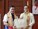 Assam chief minister Himanta Biswa Sarma (left) with state finance minister Jayanta Mallabaruah in Guwahati on Friday. (ANI)