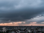 Clouds hover over the Delhi skyline as seen from Lotus Tower in New Delhi, India, on Thursday, July 9, 2026. The city witnessed cloudy skies amid changing monsoon weather conditions. 