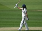 India's Harmanpreet Kaur celebrates reaching her 50 against England on the first day of the first Women's cricket Test at Lord's cricket ground in London. (AFP)