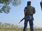A Myanmar border policeman stands near the Taungpyo Bangladesh-Myanmar border gate on the outskirts of Maungdaw in Rakhine state.(AFP)