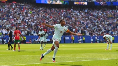Kylian Mbappe celebrates scoring the opening goal during the World Cup quarterfinal. (AP Photo/Steven Senne)