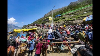Pilgrims move towards Amarnath cave shrine during the ongoing annual Amarnath Yatra 2026, in Baltal on Friday. (PTI) Pilgrims move towards Amarnath cave shrine during the ongoing annual Amarnath Yatra 2026, in Baltal on Friday. (PTI)